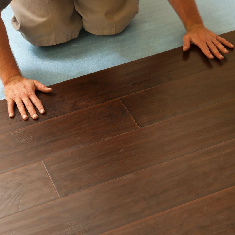 person installing flooring - Cut-Rite Carpets & Design Center in Scarsdale, NY