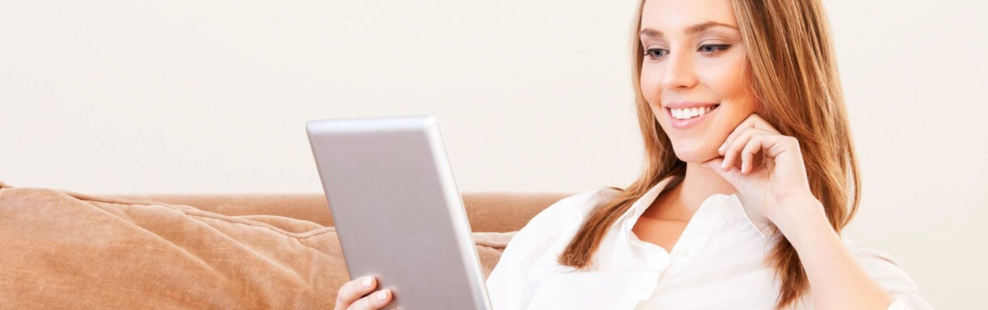 Woman looking at tablet - Cut-Rite Carpets & Design Center in NY