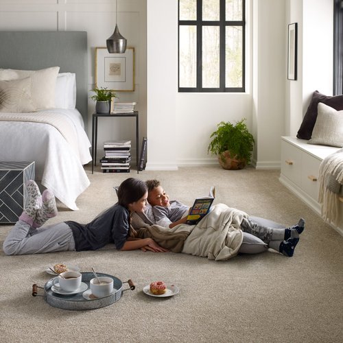 kids laying on carpet reading a book - Cut-Rite Carpets & Design Center in NY