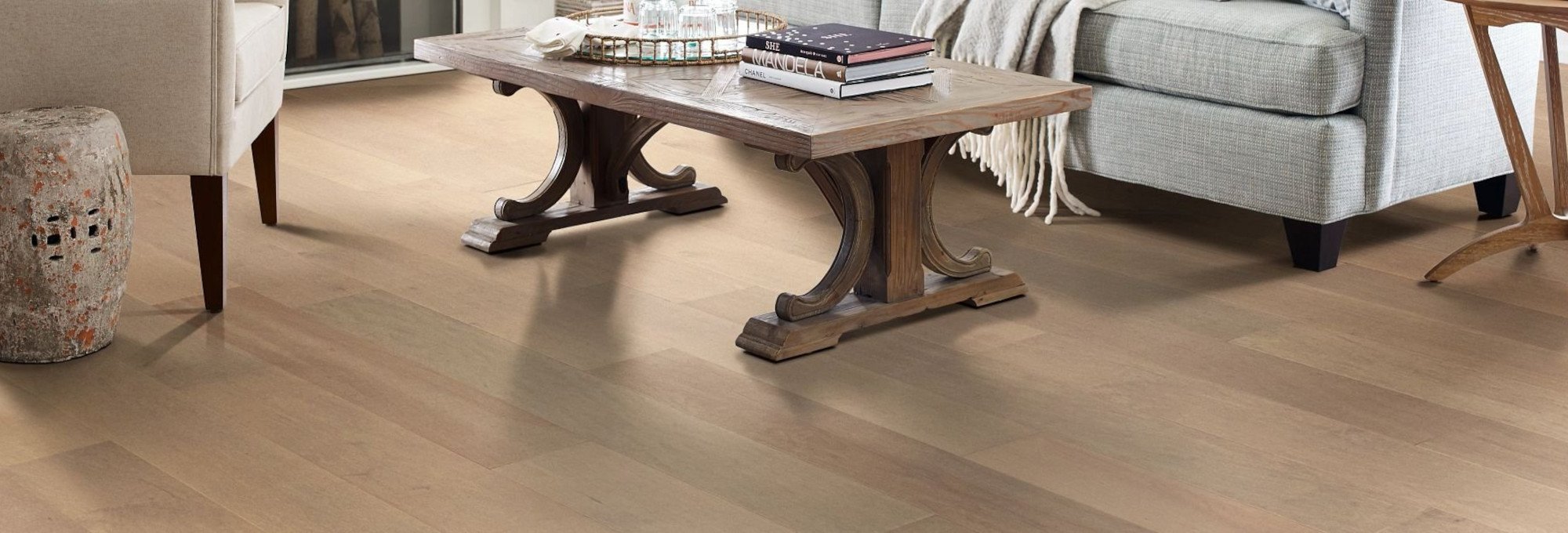 Table and white couch on hardwood floor - Cut-Rite Carpets & Design Center in Scarsdale, NY