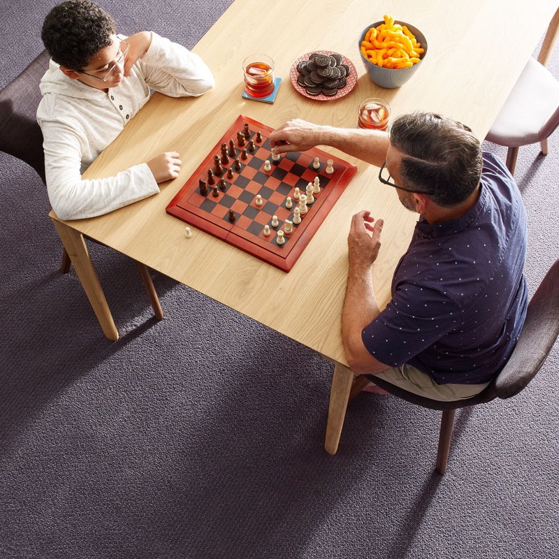 father and son playing chess - Cut-Rite Carpets & Design Center in Scarsdale, NY